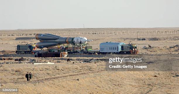 The Soyuz FG launch vehicle carrying the Soyuz TMA-6 escape spacecraft is transferred and erected on the launch pad at the Baikonour cosmodrome on...