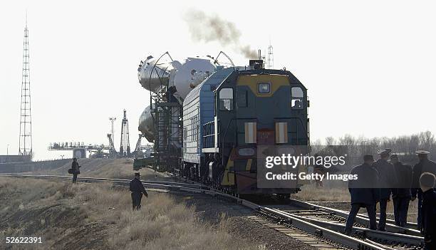 The Soyuz FG launch vehicle carrying the Soyuz TMA-6 escape spacecraft is transferred and erected on the launch pad at the Baikonour cosmodrome on...