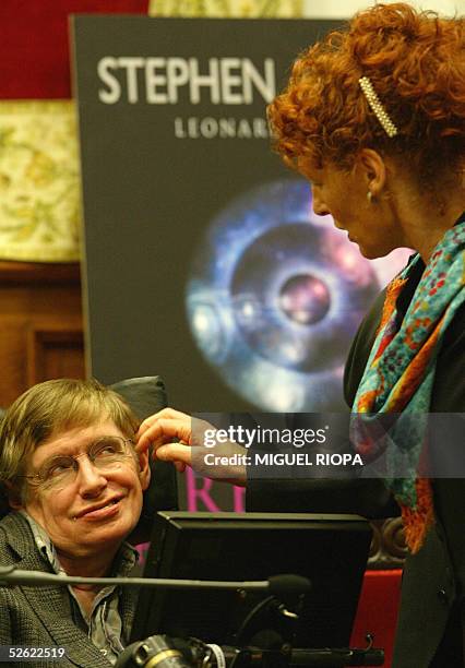 British astrophysicist Stephen Hawking smiles to his wife before the presentation of his new book "A brief history of Time" in Oviedo, northern...