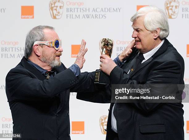 Terry Gilliam and Joe Dunton attend the press room at the "BAFTA" ceremony at the Royal Opera House.