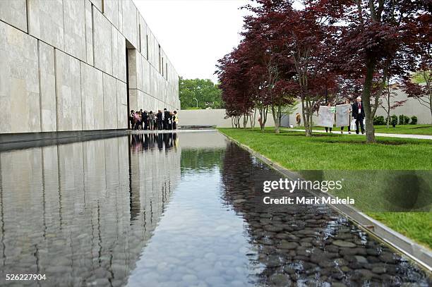 May 16, 2012 - Philadelphia, PA, U.S - Visitors exit the Barnes Foundation with canvas reprints of Impressionist masterpieces. The museum opened in...