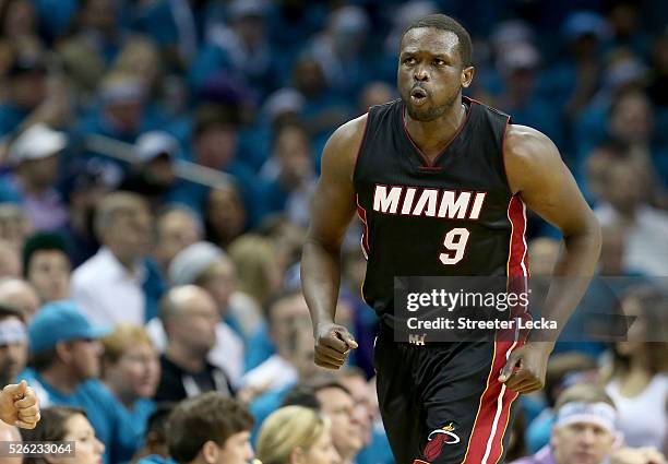 Luol Deng of the Miami Heat reacts after a basket against the Charlotte Hornets during game six of the Eastern Conference Quarterfinals of the 2016...