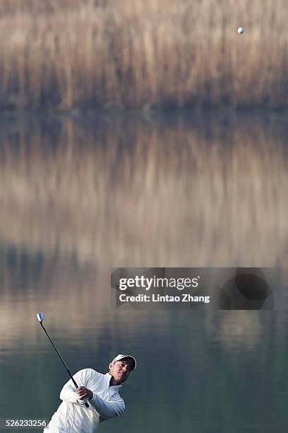 Gareth Paddison of New Zealand of Finland plays a shot during the second round of the Volvo China open at Topwin Golf and Country Club on April 30,...