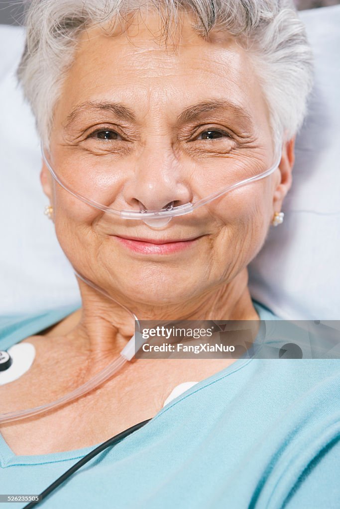 Senior woman sitting in the stretcher