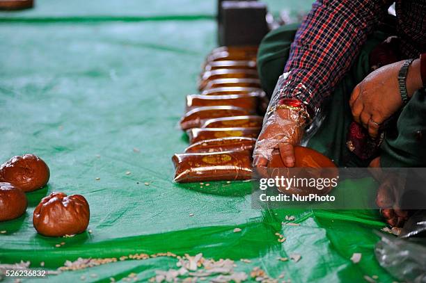 Local packing molasses Chaku for final consuming on 06 January, 2015 at Tokha, Kathmandu, Nepal for the celebration of Maghe Sankranti Festival...