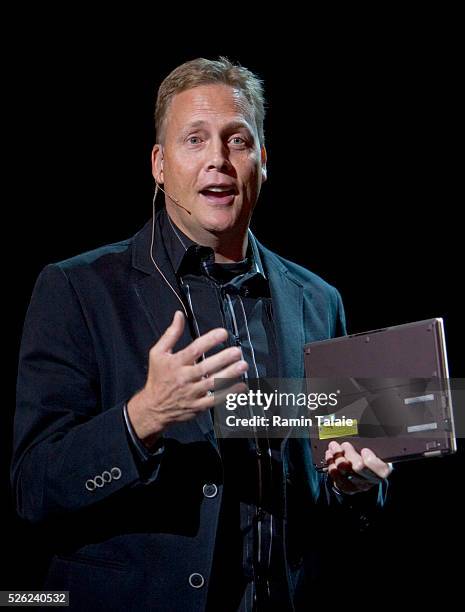 Dave Fester, General Manager of Microsoft Corp.'s Windows Digital Media division, holds a Sony Vaio X Series notebook as he speaks during the...