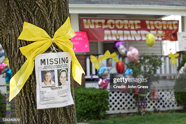 Missing person poster for Amanda Berry, one of the three woman found alive after vanishing for about a decade in their own neighborhood, is pictured...
