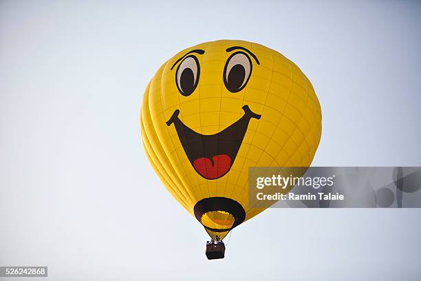Hot air balloon with a smiley face launches during the New Jersey Festival of Ballooning at Solberg Airport in Readington, NJ, on Saturday July 24,...