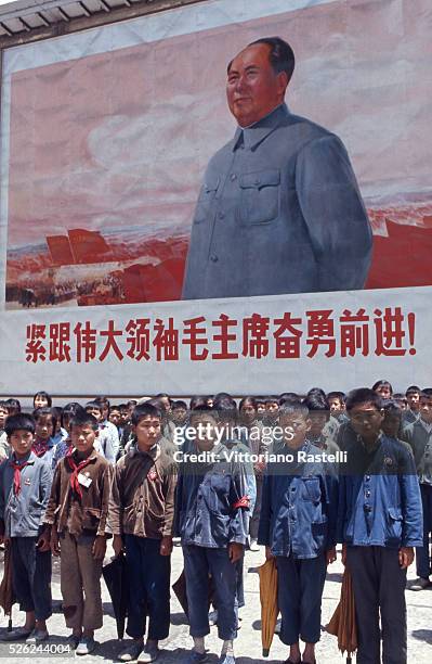 Shanghai, China - School children attend a lesson on the Cultural Revolution close to a houge portrait of President Mao Zedong in Shanghai May 24 1971