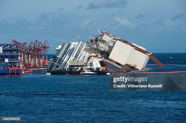 Giglio Island, Italy - The Costa Concordia cruise liner is shown ONE hours after the start of the operation to have it turned upright at Giglio...
