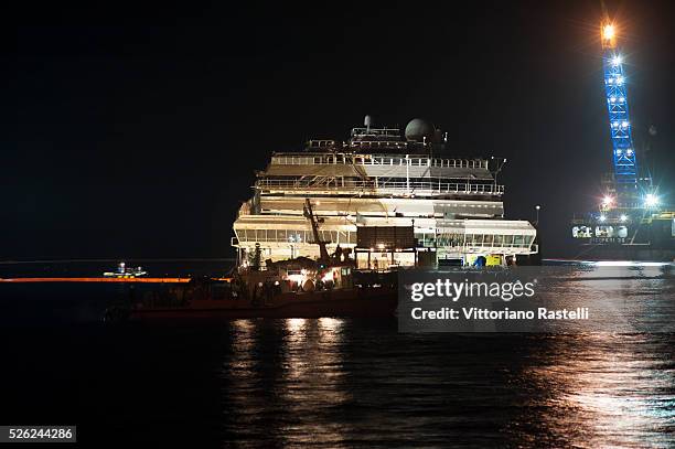 Giglio Island, Italy - The Costa Concordia cruise liner is shown at the end of the operation to have it turned upright at Giglio Island, Italy...