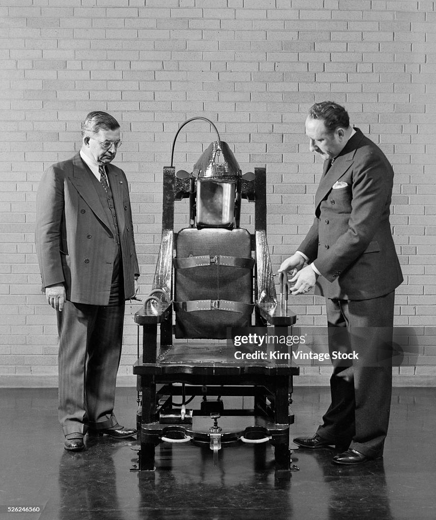 Illinois officials look over their electric chair, ca. 1938