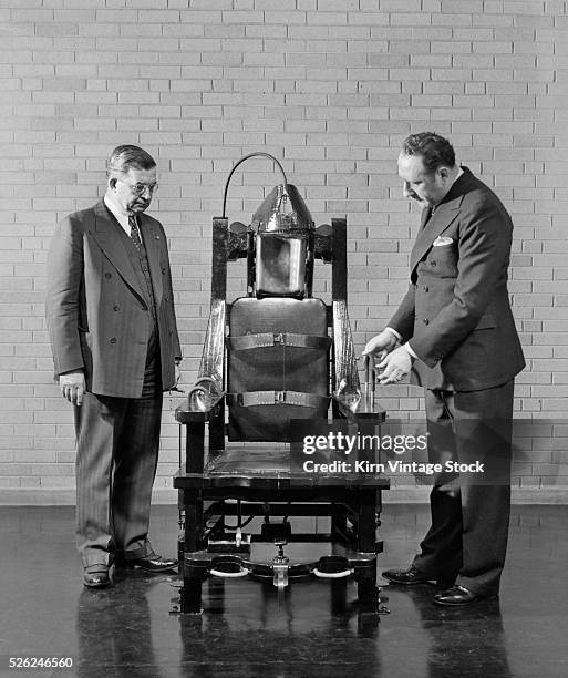 Illinois officials look over their electric chair, ca. 1938