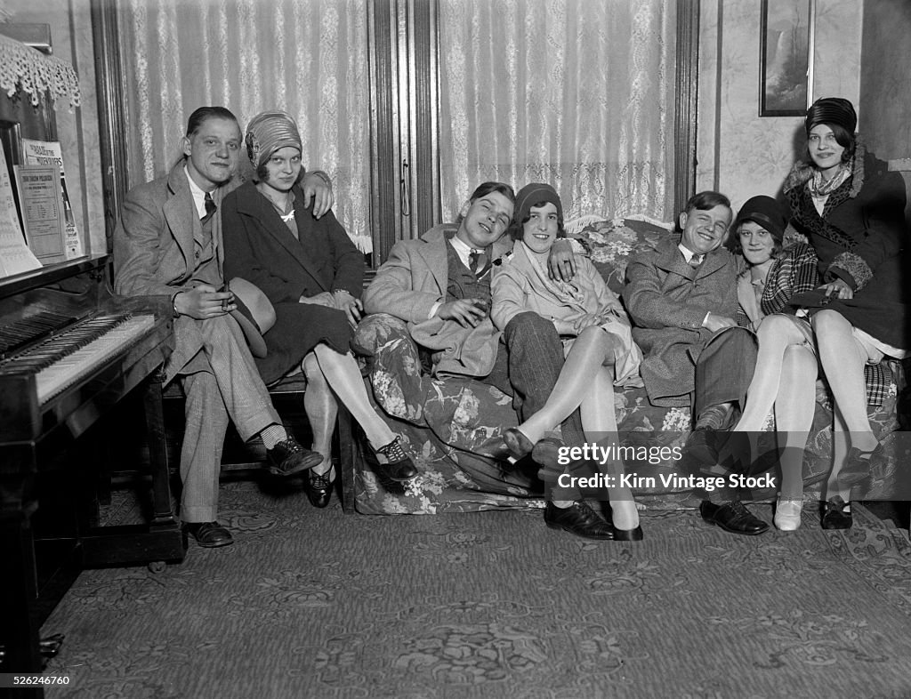 Young couples group on a couch, ca. 1928