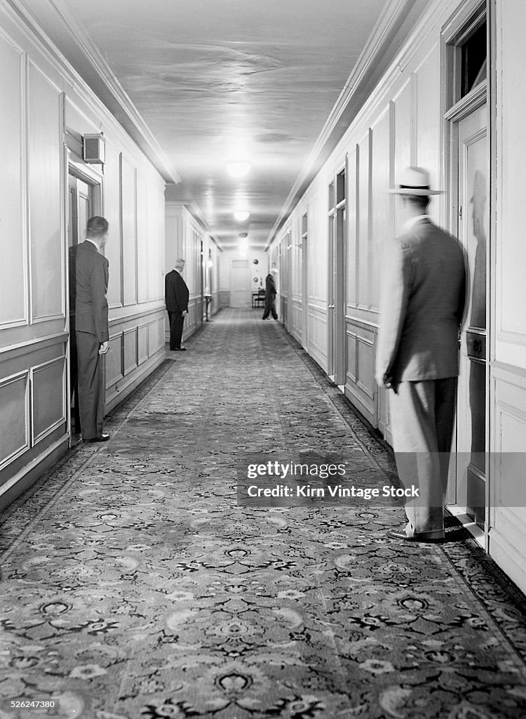 Men stand in hotel doorways in Chicago, ca. 1946