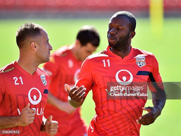 Tarek Elrich of United chats with Bruce Djite of United during an Adelaide United A-League training session at Coopers Stadium on April 30, 2016 in...