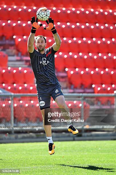 United goalkeeper Eugene Galekovic makes a save during an Adelaide United A-League training session at Coopers Stadium on April 30, 2016 in Adelaide,...