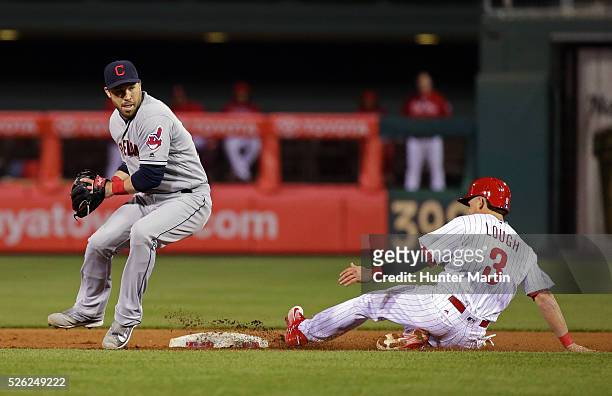 David Lough of the Philadelphia Phillies is forced out at second base by Jason Kipnis of the Cleveland Indians in the 10th inning during a game at...