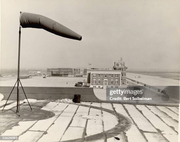 View of Floyd Bennett Field airport in Brooklyn shows the windsock which indicates wind direction and strength, the main building and control tower,...