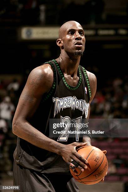 Kevin Garnett of the Minnesota Timberwolves shoots a free throw against the New Jersey Nets during the game at Continental Airlines Arena on March...