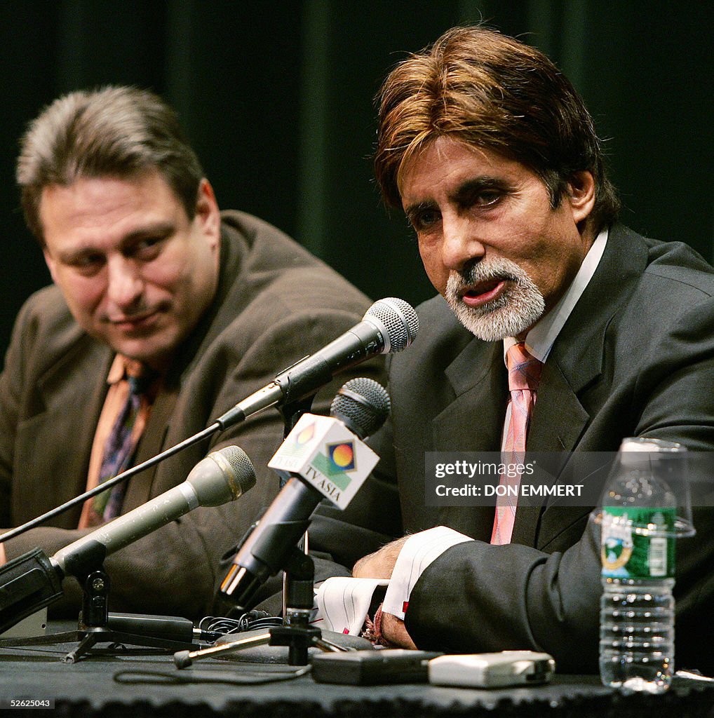 Indian actor Amitabh Bachchan (R) takes