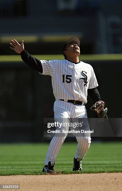 Tadahito Iguchi of the Chicago White Sox signals to catch a fly ball during the game with the Cleveland Indians on April 7, 2005 at U.S. Cellular...