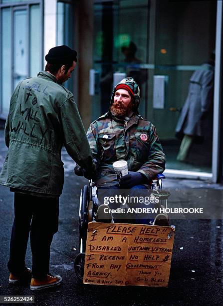 September 1988 - Homeless, disabled, Vietnam veteran panhandling in Penn Plaza.