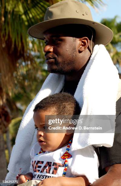 Shaquille O'Neal of the Miami Heat looks on with his son Shaqir during the eighth Annual Miami Heat Family Festival on March 20, 2005 at the...