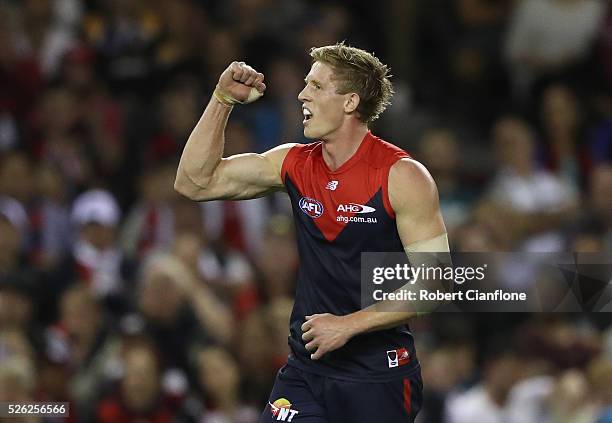 Sam Frost of the Demons celebrates a goal during the round six AFL match between the Melbourne Demons and the St Kilda Saints at Etihad Stadium on...