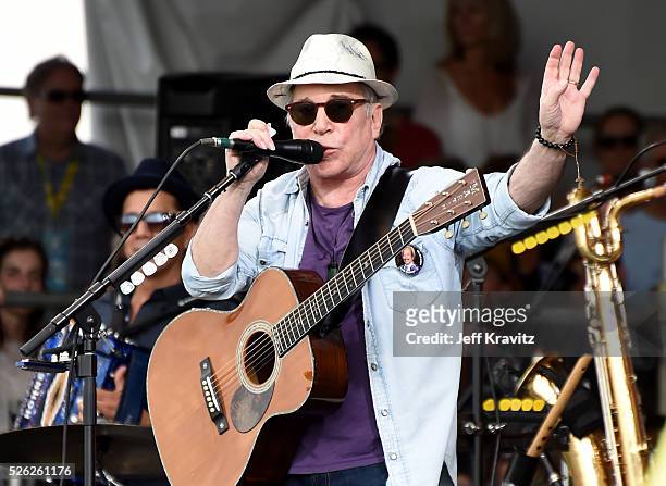 Musician Paul Simon performs onstage during the 2016 New Orleans Jazz & Heritage Festival at Fair Grounds Race Course on April 29, 2016 in New...