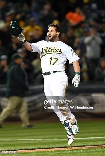 Yonder Alonso of the Oakland Athletics celebrates after he hit a walk-off three-run homer against the Houston Astros in the bottom of the ninth...