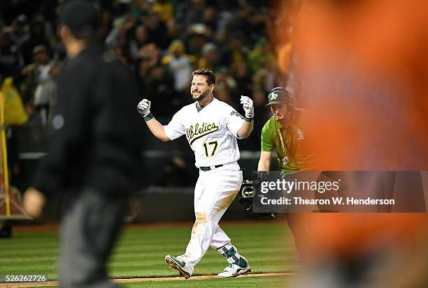 Yonder Alonso of the Oakland Athletics celebrates after he hit a walk-off three-run homer against the Houston Astros in the bottom of the ninth...