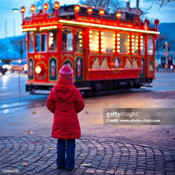 girl and the christmas tram - zurich christmas stock pictures, royalty-free photos & images