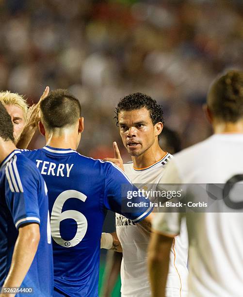 Real Madrid player Pepe gives a warning to Chelsea FC player Captain John Terry during the Championship match between Chelsea FC and Real Madrid...