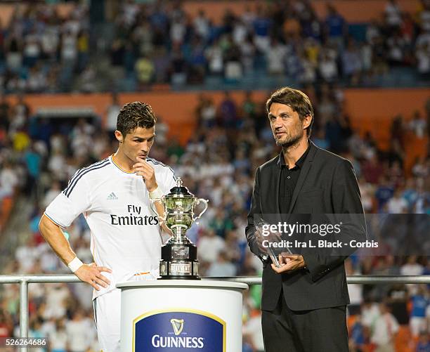 Real Madrid player Cristiano Ronaldo is awarded the Man of the Match by former player Paolo Maldini after the Championship match between Chelsea FC...