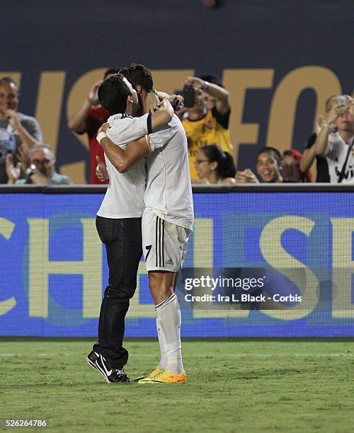 Real Madrid player Cristiano Ronaldo gets a hug from a fan during the Championship match between Chelsea FC and Real Madrid during the Guinness...