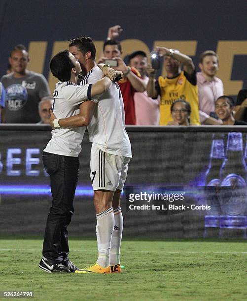 Real Madrid player Cristiano Ronaldo gets a hug from a fan during the Championship match between Chelsea FC and Real Madrid during the Guinness...