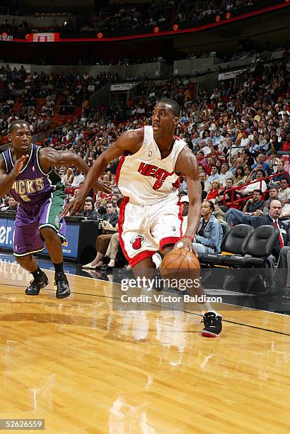 Eddie Jones#6 of the Miami Heat drives the lane against Anthony Goldwire of the Milwaukee Bucks during NBA action on March 14, 2005 at American...