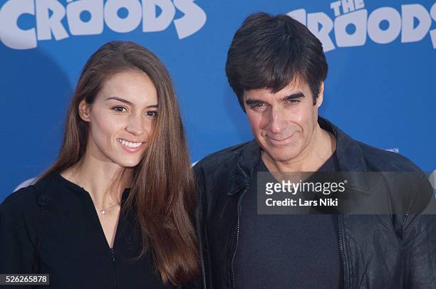 Chloe Gosselin and David Copperfield attend The Croods film premiere at the AMC Loews Lincoln Square in New York City. �� LAN