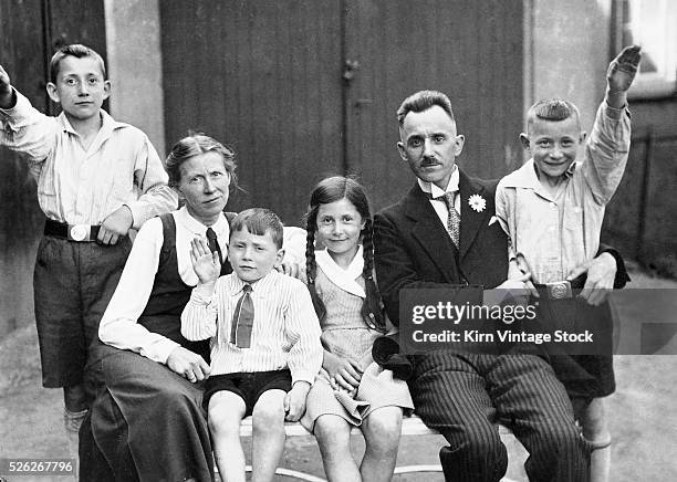 Mother and father pose with their children for a family portrait in Germany.