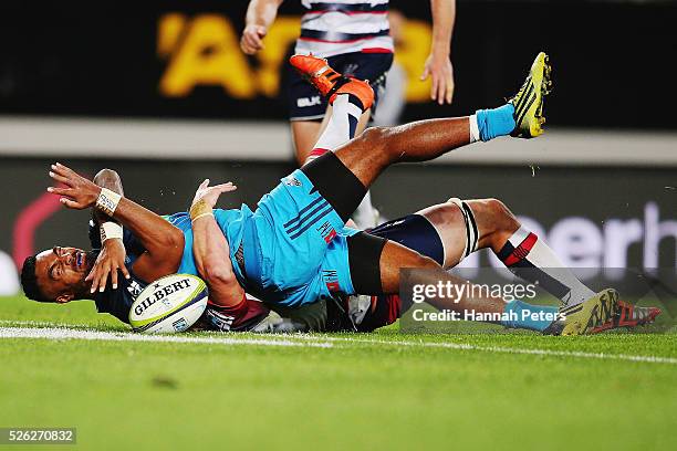 Lolagi Visinia of the Blues reaches out to score a try during the Super Rugby round ten match between the Blues and the Melbourne Rebels at Eden Park...