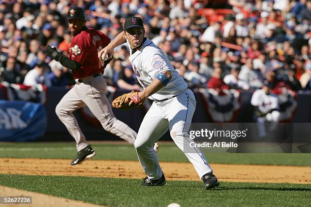 Third Baseman David Wright of the New York Mets throws the ball as infielder Jose Vizcaino of the Houston Astros runs to third base during the Mets...