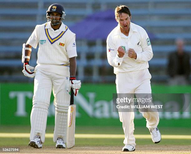 New Zealand bowler Nathan Astle leaps for joy as he dismisses Sri Lankan batsman Tillakaratne Dilshan while Chaminda Vaas looks on, on the fourth day...