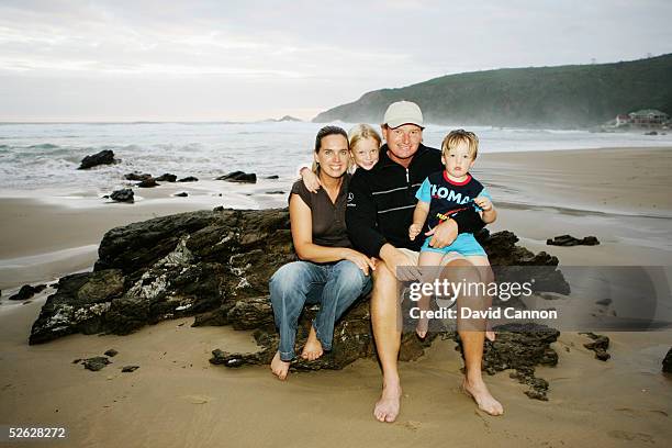 Ernie Els of South Africa with is wife Liesl, and children Samantha, and Ben on the beach in Herold's Bay, on February 25 in Herold's Bay, South...