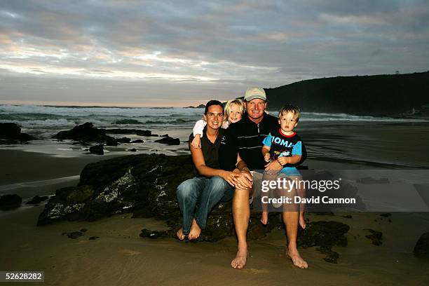Ernie Els of South Africa with is wife Liesl, and children Samantha, and Ben on the beach in Herold's Bay, on February 25 in Herold's Bay, South...