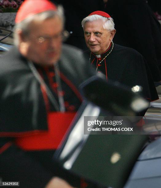German Cardinals Karl Lehmann and Joseph Ratzinger leave the Paul VI hall at the end of the General Congregation assembly of the Cardinals at the...