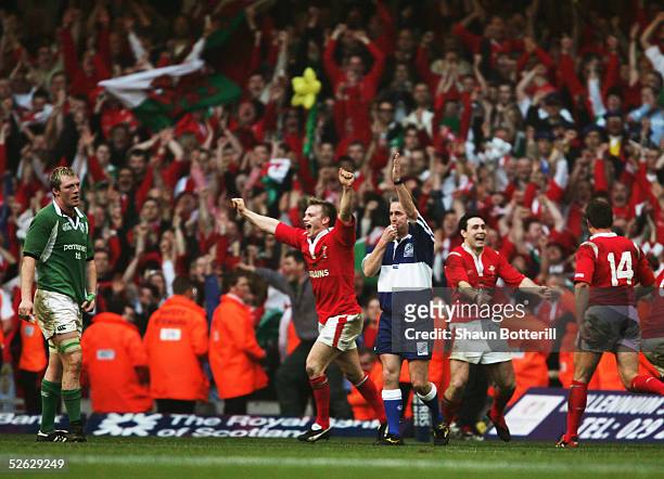 Welsh celebrations begin as Referee Chris White blows the final whistle during the RBS Six Nations match between Wales and Ireland at the Millenium...