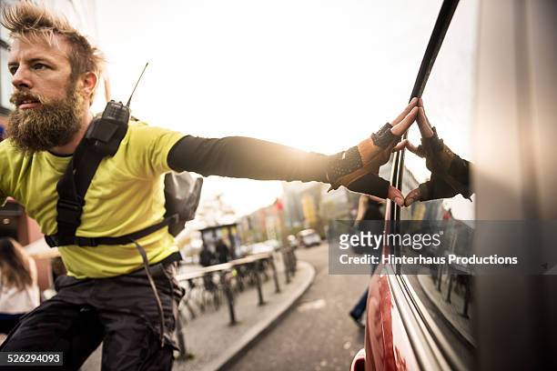 bike messenger on bicycle - bicycle courier stock pictures, royalty-free photos & images