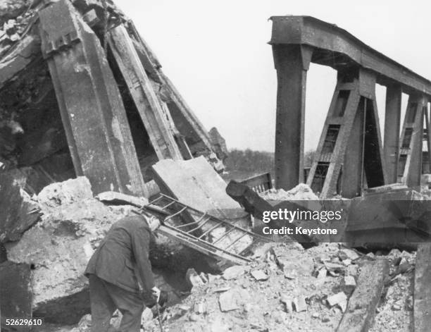 British statesman Winston Churchill inspects the ruins of a bridge over the Rhine at Wesel, Germany, 27th March 1945.