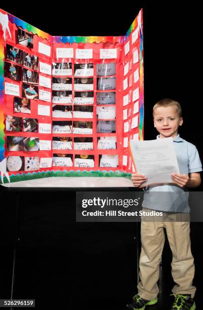 caucasian boy presenting project at science fair - school fair stock pictures, royalty-free photos & images
